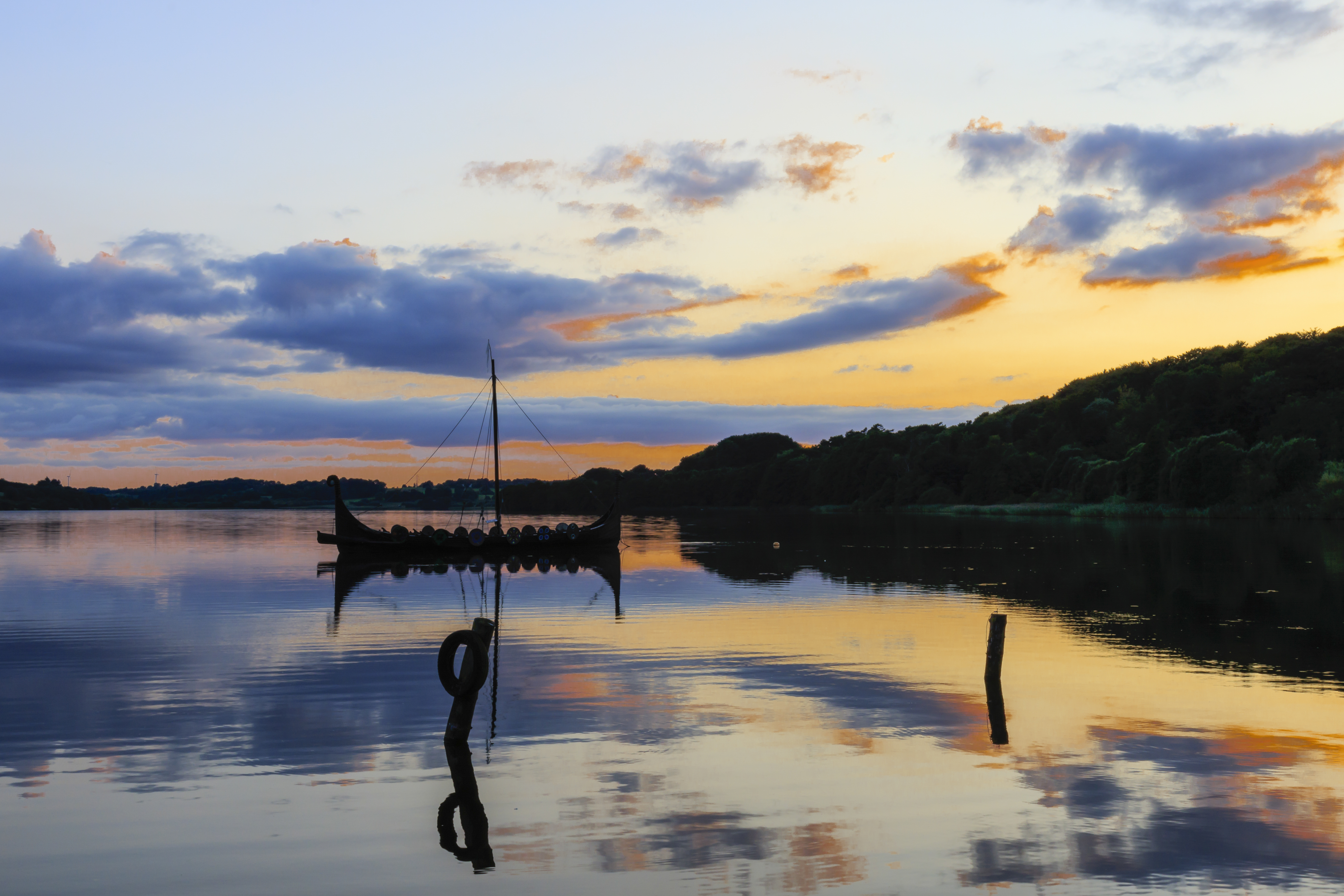 Sunset by the lake with boat